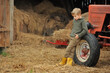 © Jacek - Little boy in the countryside next to the tractor