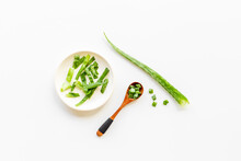 Aloe Vera Plant With Leaves And Slices In Wooden Spoon