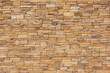 Stone tile of mosaic exterior cover on modern building, material Seamless textured wall background