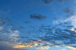 Puffy altocumulus clouds in a blue sunrise sky