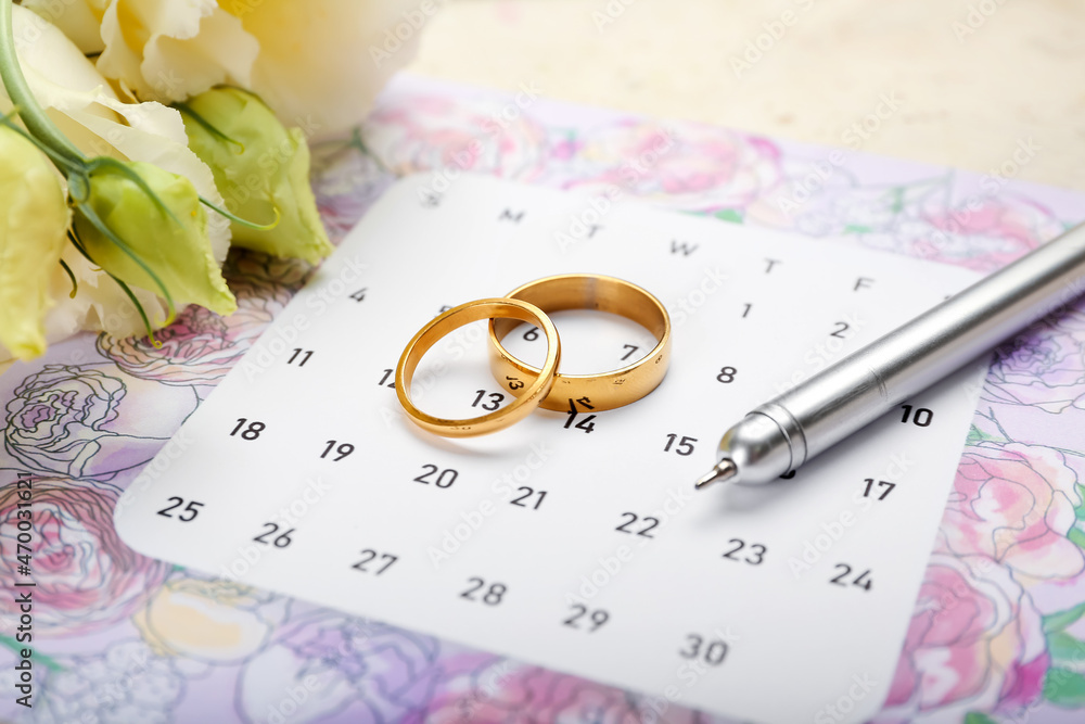 Beautiful composition with wedding calendar on table