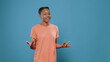 African american woman singing song and gesticulating with hands in front of camera. Carefree person doing dance moves and chanting, feeling happy with music over isolated background
