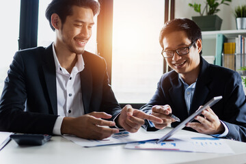 Wall Mural - legal and businessman advisor, two business people talking, planning analyze investment and marketing on tablet in office.