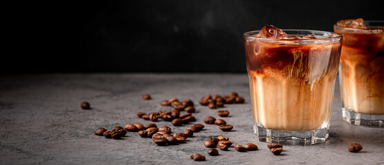 Wall Mural - Ice coffee in a glass with cream poured over.