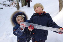 Kids Boys With Big Icicle In Winter 