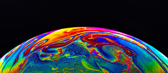 Wall Mural - Virtual reality space with abstract multicolor psychedelic planet. Closeup Soap bubble like an alien planet on black background.