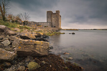 Dramatic Cloudy Scene Of Oranmore Castle On Rocky Shore Of Wild Atlantic Way In County Galway, Ireland 