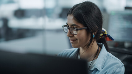 Poster - Diverse Office: Portrait of Beautiful Indian IT Programmer Working on Desktop Computer. Female Specialist Wearing Glasses Create Innovative Software. Professional Engineer Develop Inspirational App