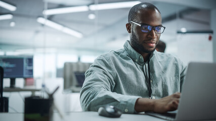 Poster - Modern Office: Portrait of Motivated Black IT Programmer Working on Laptop Computer. Male Specialist Create Website, Software Engineer Develop App, Program, Video Game. Stress Free Inclusive Space