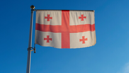 Flag of Georgia against the blue sky with sun rays and lens flare. Diplomacy concept. International relations.