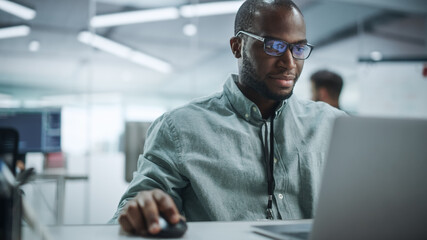 Poster - Modern Office: Portrait of Happy Black IT Programmer Working on Laptop Computer. Male Specialist Create Website, Software Engineer Develop App, Program, Video Game. Stress Free Inclusive Environment