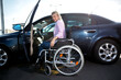 Disabled woman making a safe approach to her automobile