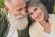 © deagreez - Cropped photo of cute elder couple hug wear shirt walk in park outside outdoors