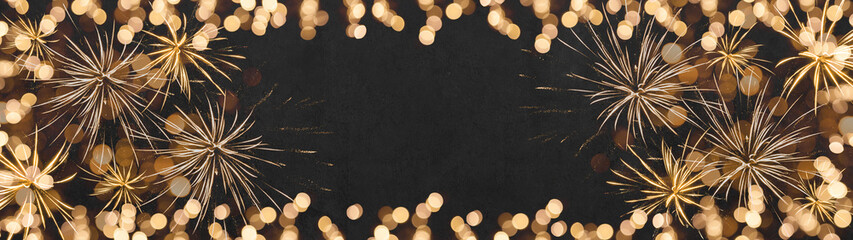 Frame of lights bokeh golden flares and firework, isolated on black concrete night texture - New Year's Eve Silvester New Year Party fireworks festive background banner panorama  greeting card.