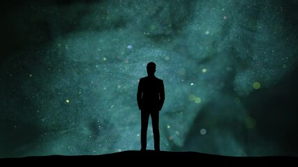 Wall Mural - the businessman standing on a blue shimmering particles background