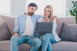© deagreez - Photo of dream married couple sit couch enjoy netbook movie wear casual outfit in comfortable home indoors