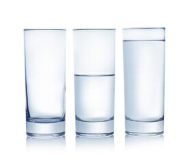 Wall Mural - Empty, half and full glasses of water on white background