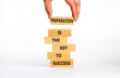 Preparation and success symbol. Wooden blocks with words Preparation is the key to success on on a beautiful white background, copy space. Businessman hand. Business, preparation and success concept.