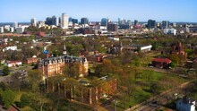 Aerial Tracking Shot Of Fisk University Featuring Jubilee Hall And The City Skyline In Nashville Tennessee