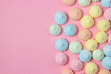 Multicolored Meringues On A Pink Background. Dessert On A Bright Background, There Is A Place For Copy Space