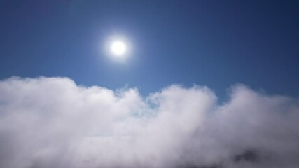 Wall Mural - move forward to sun is rising above the morning mists fog of clouds over the tree-covered mountain s