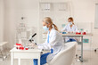 © Pixel-Shot - Scientist studying sample in laboratory