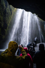 Thorsmerkurvegur, Southern Iceland: June 22, 2021: Tourists at Gljufrabui waterfall in south Iceland. Gljúfrafoss, or Gljúfrabúi waterfall is hidden in a narrow canyon that pours into a pool