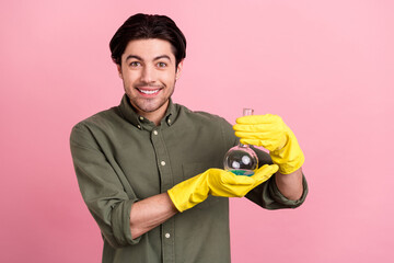 Poster - Photo of cheerful laborant worker guy demonstrate flask wear gloves khaki shirt isolated pink color background