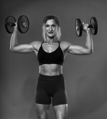 Female bodybuilder working out, black and white