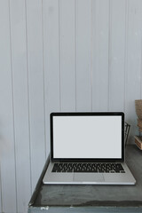 Wall Mural - Minimalist home office desk workspace. Laptop computer with blank mockup copy space screen on table. Front view template for blog, social media, website