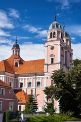 Wall Mural - Bell towers of a baroque Catholic church in the city of Sierakow