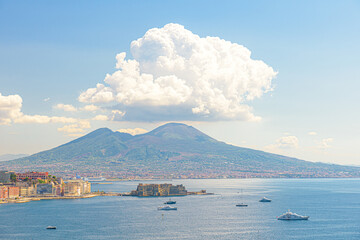 Wall Mural - Naples, Italy. August 31, 2021. View of the Gulf of Naples from the Posillipo hill with Mount Vesuvius far in the background and some boats near Castel dell'Ovo.
