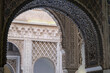 Patios, courtyards garden halls hallways colonnades frescoes tiles pillars in Moorish Arabian interior architecture design style with oppulent decor and textures inside Real Alcazar in Sevilla, Spain