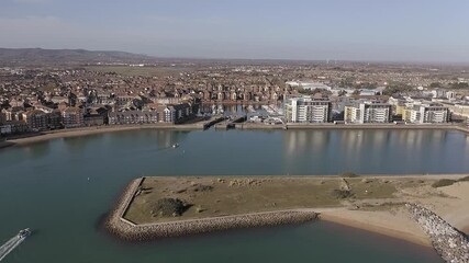 Wall Mural - Aerial footage of the lock entrance to Sovereign Harbour in Eastbourne with boats heading towards the Marina.