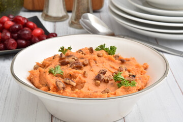 Wall Mural - Bowl of mashed sweet potatoes with pecans