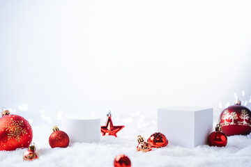 Wall Mural - Winter Christmas composition with geometric shapes podiums and red christmas decorations on white background. Empty pedestal for product presentation and for advertising display