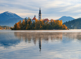 Wall Mural - lake bled in slovenia. church on an island in the middle of the lake. autumn landscape at dawn. larg