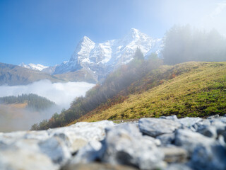 Poster - Mountain range through the clouds. Landscape in the summertime. Large resolution photo for design.