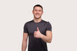 © Alex - Man Smilling Showing Thump Up Isolated. Sportsman Thumb Up