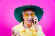 Funny grandmother portraits. Senior old woman, interacting with a smartphone. Concept about seniority