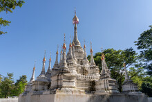 View Of Ancient White Stupa With Multiple Spires And Golden Finials Outside Wat Tham Chiang Dao Cave Buddhist Temple, Chiang Dao, Chiang Mai, Thailand