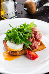 Canvas Print - healthy breakfast poached egg with bacon and arugula