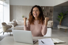 Overjoyed Emotional Businesswoman Showing Yes Gesture, Using Laptop, Celebrating Success, Excited Laughing Woman Freelancer Student Reading Good News In Email, Getting Job Promotion Or Scholarship