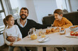 © BGStock72 - Father having breakfast with his son and daughter at home