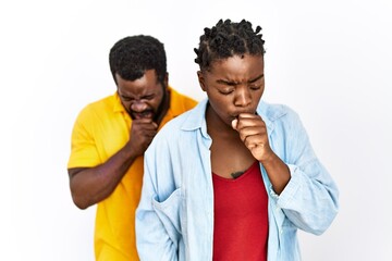 Sticker - Young african american couple wearing casual clothes feeling unwell and coughing as symptom for cold or bronchitis. health care concept.