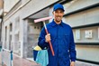 © Krakenimages.com - Young caucasian glass washer man smiling happy standing at the city.