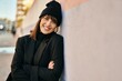 © Krakenimages.com - Young hispanic woman smiling happy standing at the city.