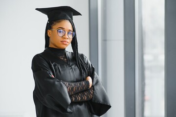 Wall Mural - A pretty african american woman graduate