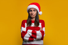 Don't Like This Christmas. Close Up Portrait Of An Unhappy And Sad Cute Young Woman With Crossed Arms