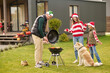 © zinkevych - A family preparing christmas dinner and looking involved